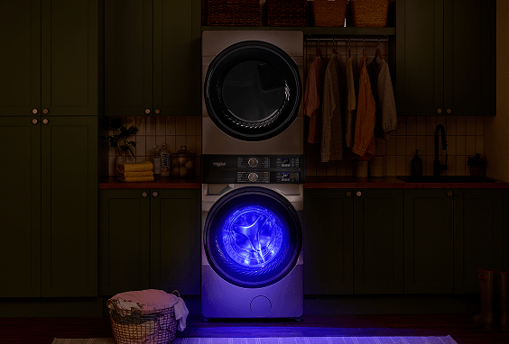 Laundry tower at night, the washer is emitting blue light