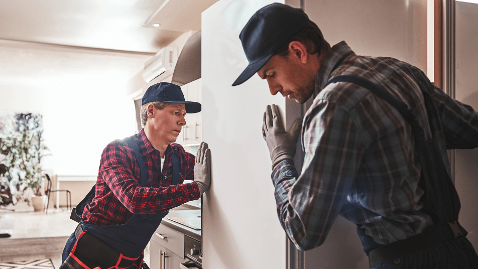 Men moving refrigerator