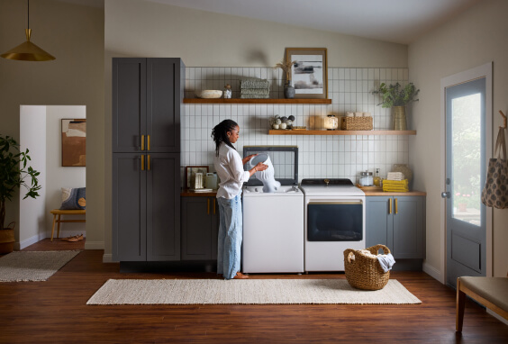 Person using top load washer